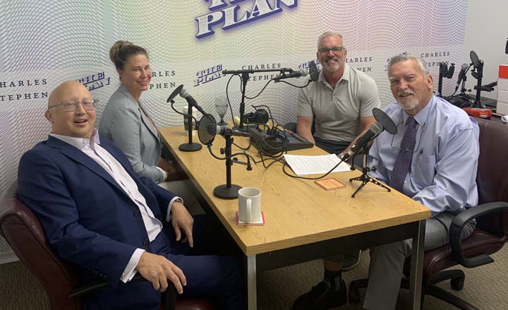 Steve Ciepiela, Kelly Famiglietta, Adam Ciepiela and Mark Smith with microphones and The Plan podcast background